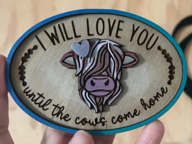 Wooden plaque with cow illustration
